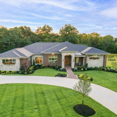 Arched Stone Entry with Brick covered Porch