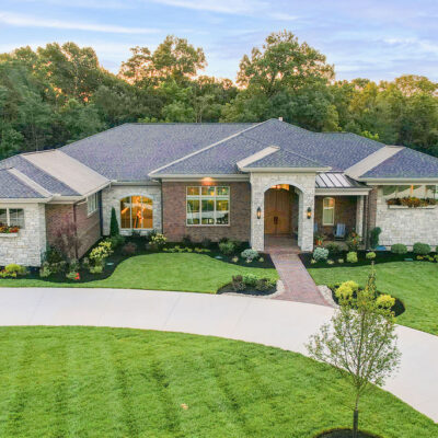 Arched Stone Entry with Brick covered Porch