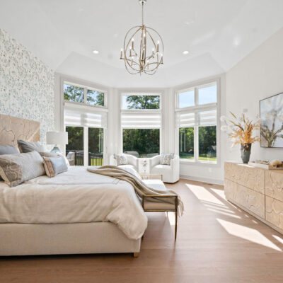 Octagon Shaped Primary Bedroom With Large Windows With Transom Above