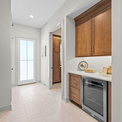 Back Hall Mudroom With Walk-Out and Bench Seat With Cabinetry, Beverage Cooler and Drop Zone