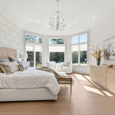 Octagon Shaped Primary Bedroom With Large Windows With Transom Above