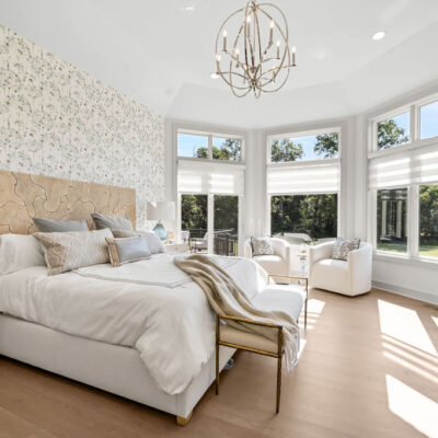 Octagon Shaped Primary Bedroom With Large Windows With Transom Above