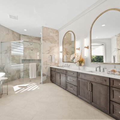 Primary Bathroom With Double Vanity and Free Standing Tub, Two Sided Fireplace With Oversized Shower and Bench