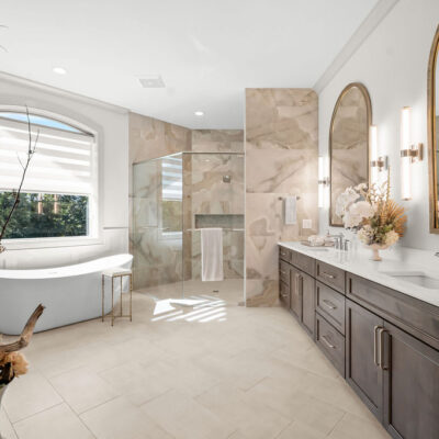 Primary Bathroom With Double Vanity and Free Standing Tub, Two Sided Fireplace With Oversized Shower and Bench