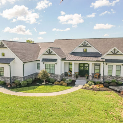 Modern Farmhouse with Gables, Siding, Metal Roof and Stone