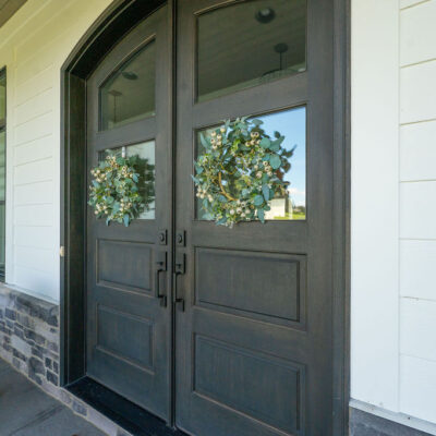 Modern Farmhouse Covered Front Porch With Curved Front Door